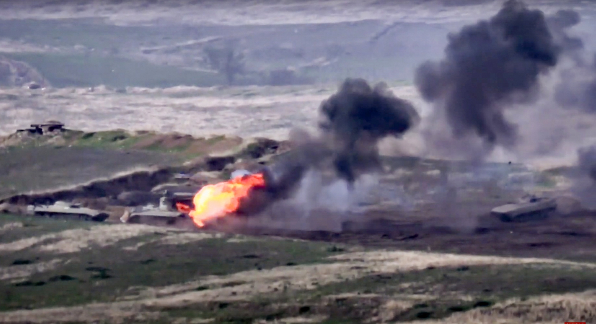 In this image taken from a footage released by Armenian Defense Ministry on Sunday, Sept. 27, 2020, Armenian forces destroy Azerbaijani military vehicle at the contact line of the self-proclaimed Republic of Nagorno-Karabakh, Azerbaijan. Fighting between Armenia and Azerbaijan has broken out around the separatist region of Nagorno-Karabakh and the Armenian Defense Ministry says two Azerbaijani helicopters have been shot down. Ministry spokeswoman Shushan Stepanyan also said Armenian forces hit three Azerbaijani tanks. (Armenian Defense Ministry via AP) ArcInfo