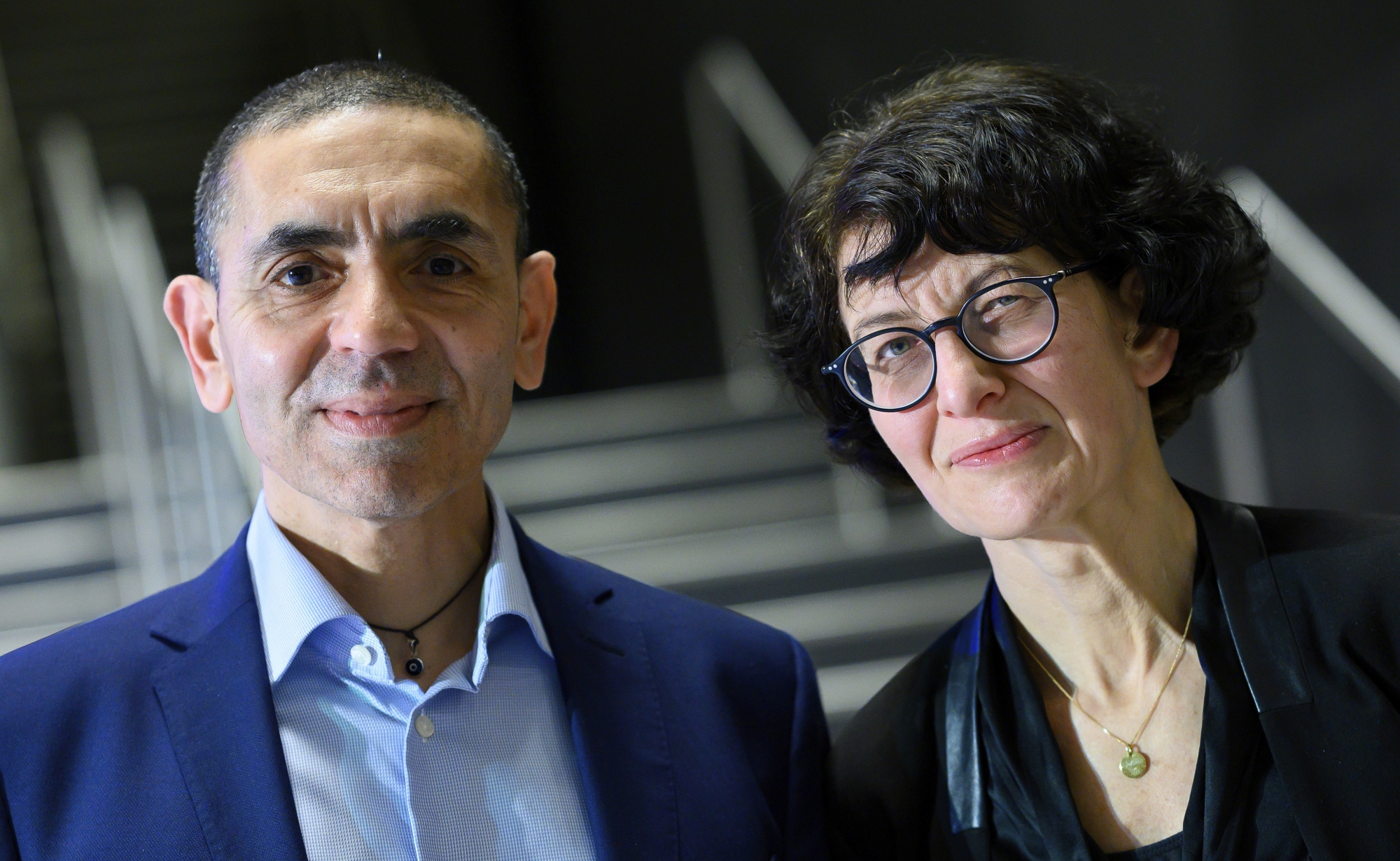 Ugur Sahin, left, with his wife Ozlem Tureci, founders of the coronavirus vaccine developer BioNTech, pose for a photo at an Axel Springer Award ceremony for the research couple broadcast on the Internet, Thursday, March 18, 2021. (Bernd von Jutrczenka/dpa via AP, Pool)