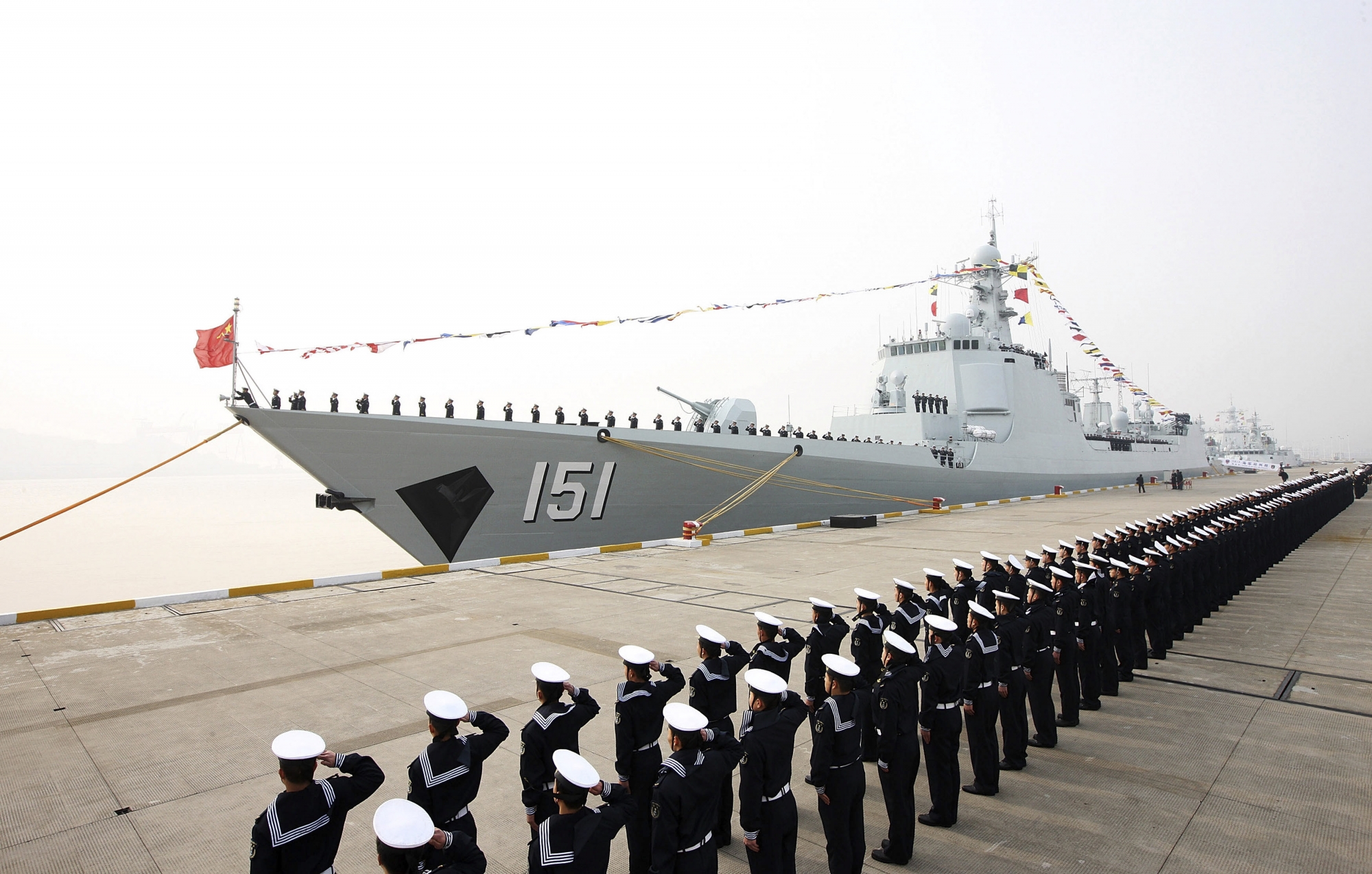 In this Thursday, Dec. 26, 2013 photo, Chinese People's Liberation Army navy personnel salute in front of a new Type 052C guided missile destroyer Zhengzhou during its commission ceremony in Zhoushan, in eastern China's Zhejiang province. (AP Photo) CHINA OUT