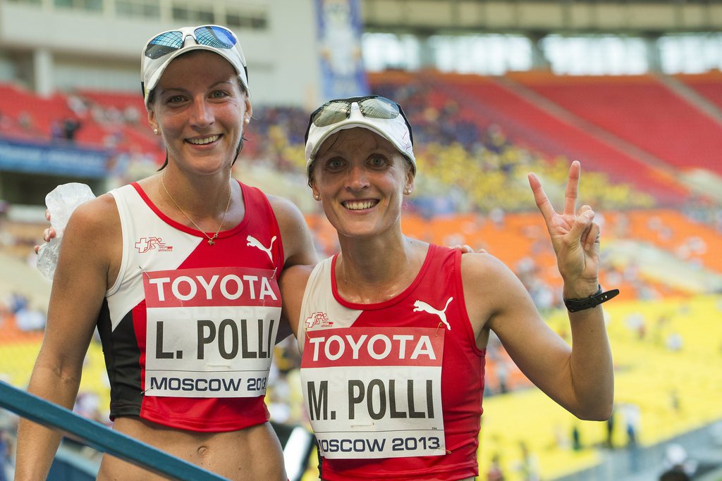 Laura Polli, left, and Marie Polli, right, of Switzerland, poses during the Women's 20km Race Walk Finale at the IAAF World Athletics Championships in the Luzhniki stadium in Moscow, Russia, Tuesday, August 13, 2013. (KEYSTONE/Jean-Christophe Bott)
