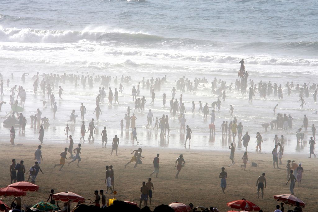 People gather on the beach of Atlantic Ocean in Casablanca, Wednesday, Sept. 6, 2006. (AP Photo/Mikhail Metzel)