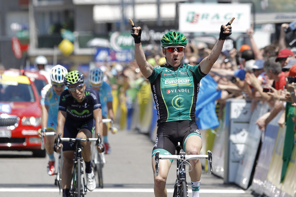 Team Europcar's Thomas Voeckler celebrates as he crosses the finish line to win the sixth stage of the 65th Dauphine cycling race between La Lechere and Grenoble, French Alps, Friday, June 7, 2013. (AP Photo/Laurent Cipriani)