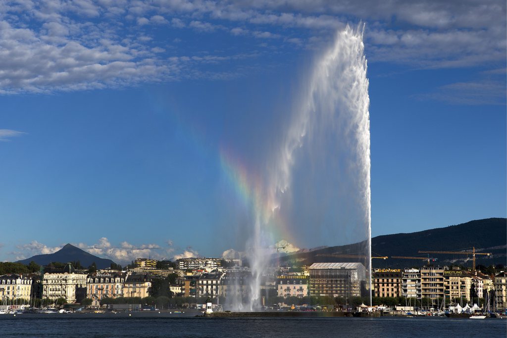 A rainbow is formed by the famous water fountain (Jet d'eau) in the Geneva's harbour, in Geneva, Switzerland, Monday,  August 12, 2013. (KEYSTONE/Salvatore Di Nolfi)