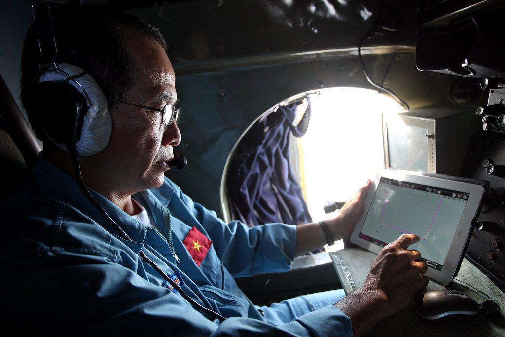 epa04119571 A military official works inside a flying Soviet-made AN-26 of the Vietnam Air Force during search and rescue (SAR) operations for a missing Malaysian Airlines flight, off Vietnam's sea, 11 March 2014. Malaysia aviation authorities say the search for the missing jet will not stop until the aircraft is located. 'There is no time frame in the search operations,' said Malaysia's aviation chief, Azharuddin Abdul Rahman. The search for Malaysia Airlines flight MH370, which went missing on 08 March 2014 with 239 people on board, has brought together nearly 100 vessels and aircraft from eight countries in Asia and the Pacific. The assistance poured in after Malaysia sought help in locating the Boeing 777-200 that disappeared en route from Kuala Lumpur to Beijing.  EPA/LUONG THAI LINH