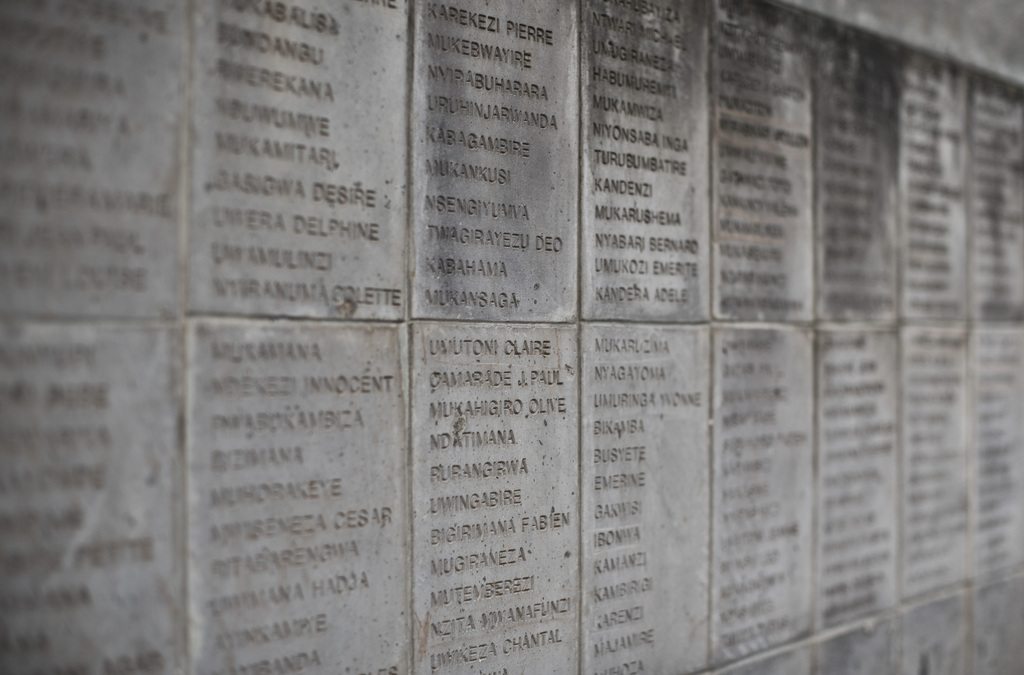 The names of some of those who were slaughtered as they sought refuge inside the church are inscribed on a stone memorial outside to the thousands who were killed in and around the Catholic church during the 1994 genocide in Ntarama, Rwanda, Friday, April 4, 2014. The country will commemorate on April 7, 2014 the 20th anniversary of the genocide when ethnic Hutu extremists killed neighbors, friends and family during a three-month rampage of violence aimed at ethnic Tutsis and some moderate Hutus, leaving a death toll that Rwanda puts at 1,000,050. (AP Photo/Ben Curtis)