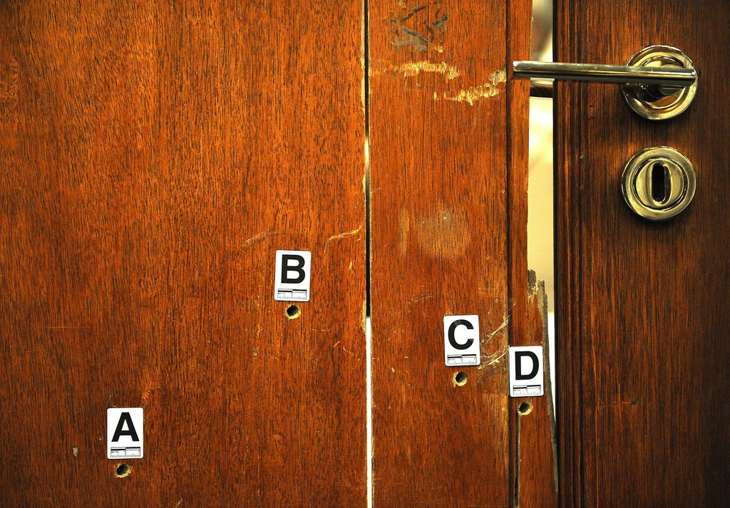epa04166958 The door through which Reeva Steenkamp was shot used as evidence and displayed during the Oscar Pistorius murder trial at the high court in Pretoria, Monday, 14 April 2014.  EPA/Antoine de Ras POOL Independent Newspapers Ltd Pool