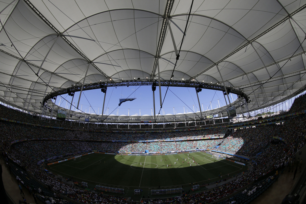 The roof opening of the Arena Fonte Nova provides sun to a portion of the pitch and stands, during the group G World Cup soccer match between Germany and Portugal, in Salvador, Brazil, Monday, June 16, 2014. Germany won 4-0. (AP Photo/Christophe Ena)