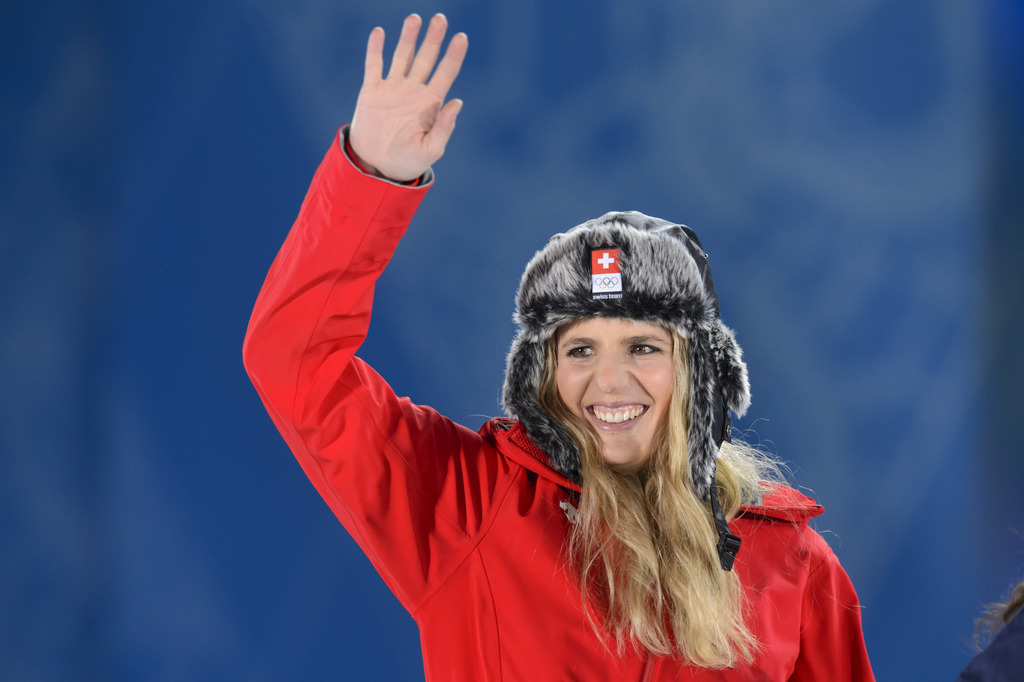 The women's snowboard parallel giant slalom gold medalist, Switzerland's Patrizia Kummer, celebrates her medal during the victory ceremony at the XXII Winter Olympics 2014 Sochi on the medal plaza in Sochi, Russia, on Wednesday, February 19, 2014. (KEYSTONE/Laurent Gillieron)
