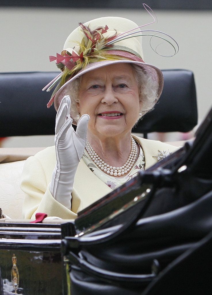 FILE - In this Friday June 17, 2011 file photo, Britain's Queen Elizabeth II waves as she arrives by carriage on the fourth day of the Royal Ascot horse race meeting at Ascot, England. Queen Elizabeth II can keep her magnificent Scottish estate at Balmoral should Scots vote for independence _ and chances are she will be able to keep her role as well. Should the Yes campaign succeed on Thursday Sept. 18, 2014, the signs are that the queen would remain the head of state of an independent Scotland _ much in the same way she is the monarch of 15 countries from Jamaica to Canada to the Solomon Islands, regions known as ?Commonwealth Realms.? (AP Photo/Alastair Grant, File)