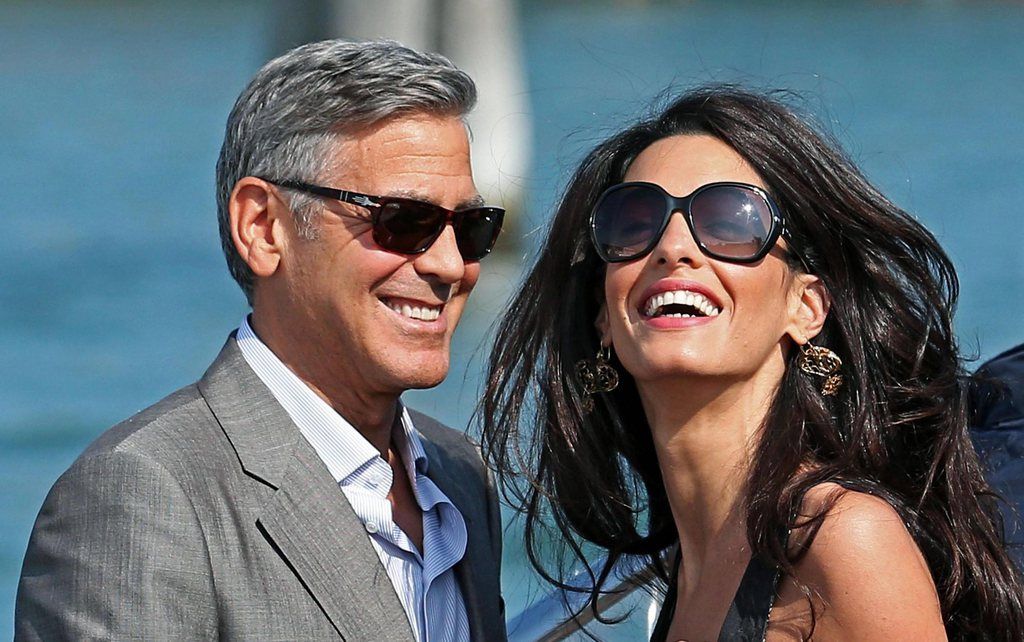 epa04418415 RECROP OF epa04418382 ..US actor George Clooney (L) and his fiance, Lebanese-British lawyer Amal Alamuddin (R) arrive in Venice, Italy, 26 September 2014. According to media reports, the wedding of George Clooney and Amal Alamuddin is to take place in Venice this weekend.  EPA/ALESSANDRO DI MEO