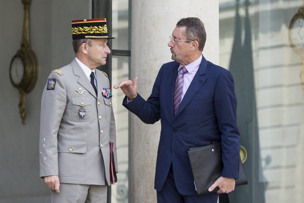 epa04416593 French Army Chief of Staff General Pierre de Villiers (L) and Head of French Intelligence Services (DGSE) Bernard Bajolet (R) leave the Elysee Palace after an extraordinary defense council with French President Francois Hollande in Paris, France, 25 September 2014. French President Francois Hollande said that the beheading of a French hostage in Algeria gives new urgency to stop terrorism and called on UN member states to support the fight.  EPA/ETIENNE LAURENT