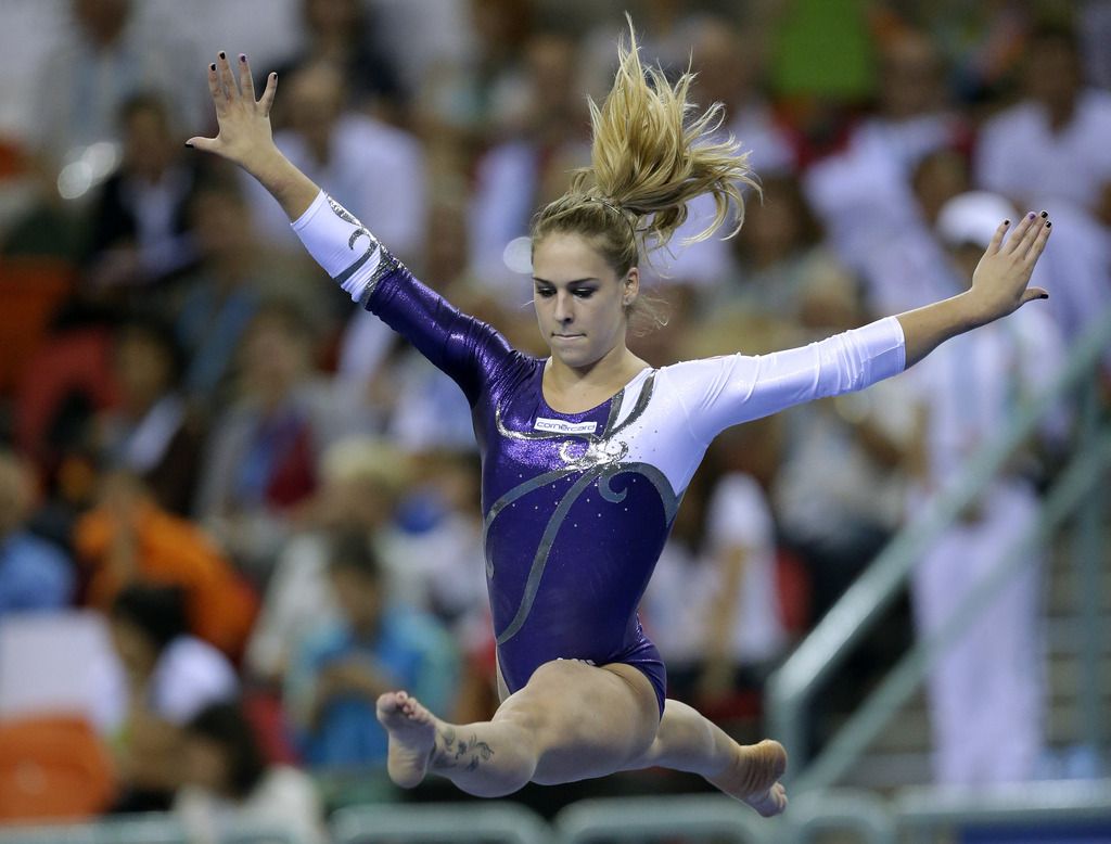 Switzerland's Giulia Steingruber performs on the balance beam during the women's all-round final of the Artistic Gymnastics World Championship at the Guangxi Gymnasium in Nanning, capital of southwest China's Guangxi Zhuang Autonomous Region Friday, Oct. 10, 2014.  (AP Photo/Andy Wong)