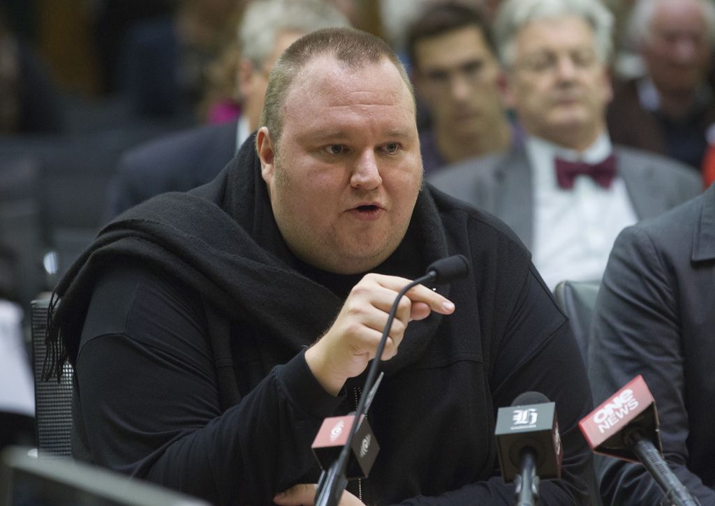 FILE - In this Wednesday, July 3, 2013 file photo, Internet entrepreneur Kim Dotcom speaks during the Intelligence and Security select committee hearing at Parliament in Wellington, New Zealand.  Indicted Internet entrepreneur Kim Dotcom has defeated efforts to send him back to a New Zealand jail but says his long-running legal battle has left him broke. (AP Photo/New Zealand Herald, Mark Mitchell, File) NEW ZEALAND OUT, AUSTRALIA OUT