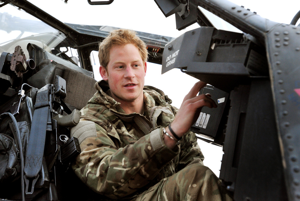 FILE - In this Dec. 12, 2012, file photo Britain's Prince Harry makes his early morning pre-flight checks on the flight-line, from Camp Bastion southern Afghanistan. Palace officials say that Prince Harry is ending his role as a helicopter pilot and taking up a new job with the army in London. Kensington Palace said Harry ? known in the army as Capt. Wales ? will now be organizing "major commemorative events" involving the army. (AP Photo/ John Stillwell, Pool)