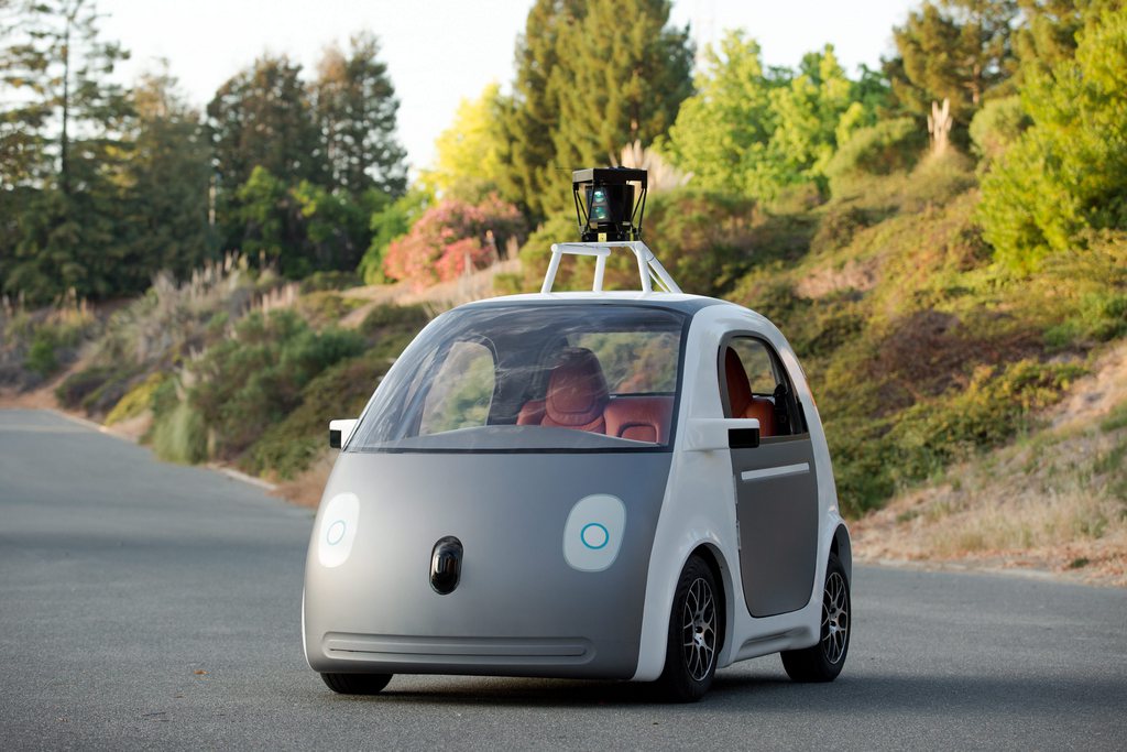 epa04538517 An undated handout picture released by Google on 23 December 2014 shows an apparently fully functioning prototype of a self-driving car taking a spin on the Google test track in Northern California, USA. Google unveiled its first 'fully functional' self-driving car on 22 December 2014, the company said. 'Today we're unwrapping the best holiday gift we could've imagined: the first real build of our self-driving vehicle prototype,' the statement on the company's Google Plus social media site said. Google announced in May 2014 it would develop its own self-driving vehicles, which would use an array of sensors and computers to navigate streets without a driver at the controls.  EPA/Google  HANDOUT EDITORIAL USE ONLY/NO SALES