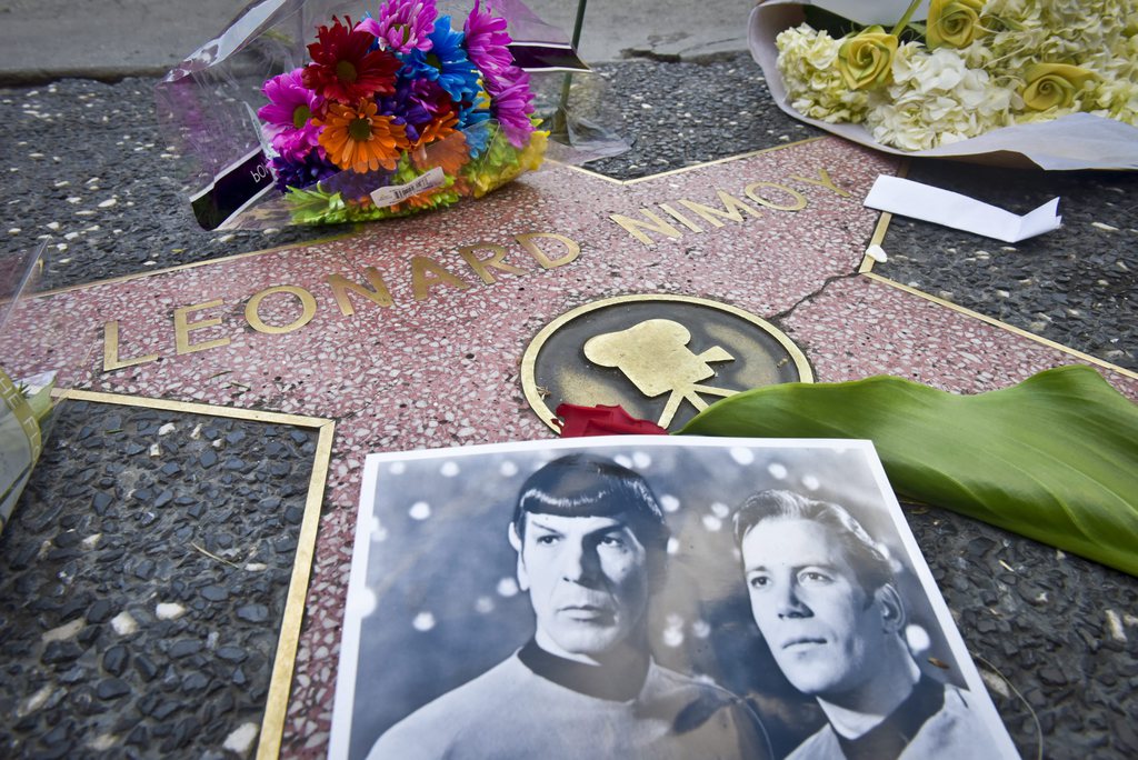 epa04641003 Flowers and notes are left at Leonard Nimoy's star on the Hollywood Walk of Fame in Hollywood, California, USA, 27 February 2015, after he died earlier that day. The 83-year-old who became world famous as one of the lead characters on the Starship Enterprise movies died at his home in Los Angeles, according to David Gersh, Nimoy's agent. The unflappable Spock, a fixture at the side of Captain Kirk, along with the other members of the crew of the Enterprise wrote television history with its racially diverse cast.  EPA/STUART PALLEY