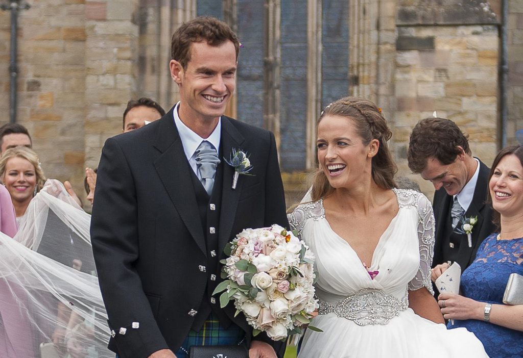 epa04700396 British tennis player Andy Murray (L) and his wife Kim (R) leave the cathedral in Dunblane near Stirling, Britain, 11 April 2015. About 300 guests are expected to attend the reception at the Hotel Cromlix after the wedding ceremony.  EPA/JOEY KELLY