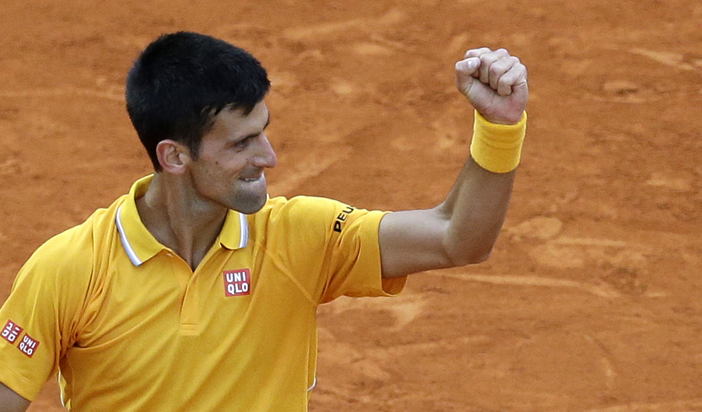 Novak Djokovic of Serbia reacts after defeating Thomas Berdych of Czech Republic in their final match of the Monte Carlo Tennis Masters tournament in Monaco, Sunday, April 19, 2015. (AP Photo/Lionel Cironneau)
