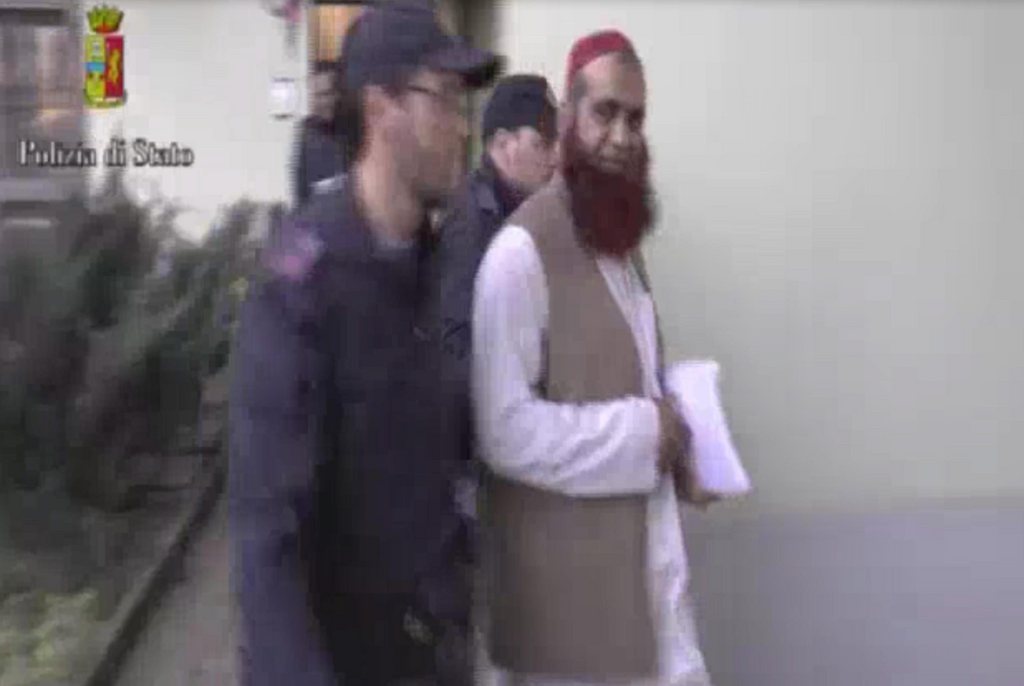 epa04718681 An image grabed from an handout video released by Italian police on 24 April 2015 shows the arrest of the spiritual leader Imam, in Bergamo, Italy, during a operation after uncovering an alleged al-Qaeda network based in Italy. Italian police launched a massive operation on 24 April after uncovering an alleged al-Qaeda network based in Italy.  EPA/POLICE PRESS OFFICE / HANDOUT BEST QUALITY AVAILABLE HANDOUT EDITORIAL USE ONLY/NO SALES