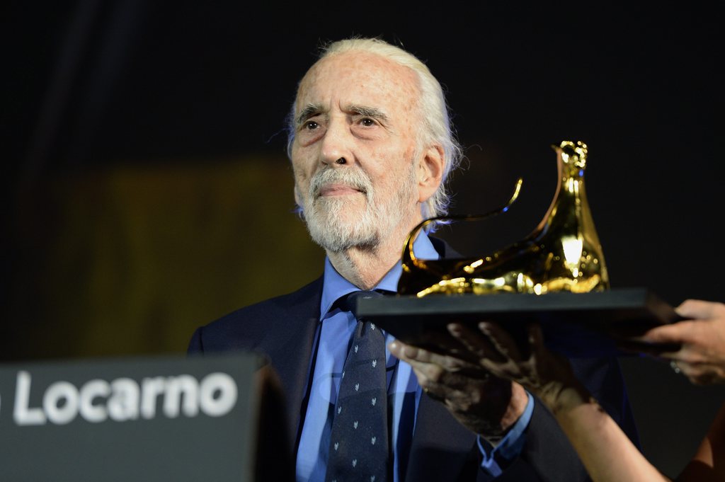 FILE - British actor Sir Christopher Lee poses with the Excellence Award during the photocall at the 66th Locarno International Film Festival, Wednesday, August 7, 2013, in Locarno, Switzerland. The festival runs from 07 to 17 August. According to an exclusive report in The Telegraph, Lee has died at the age of 93 at a hospital in London, Britain on 07 June 2015. His wife delayed the announcement to inform all close members of the family. (KEYSTONE/Urs Flueeler)