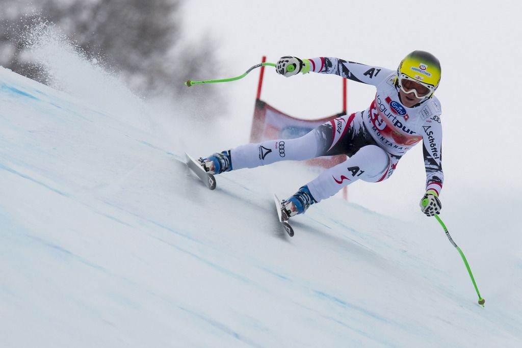Ski racer Andrea Fischbacher of Austria skies down the slope during the women's Downhill race of the FIS Alpine Ski World Cup season in Crans-Montana, Switzerland, Sunday, March 2, 2014. (KEYSTONE/Jean-Christophe Bott)