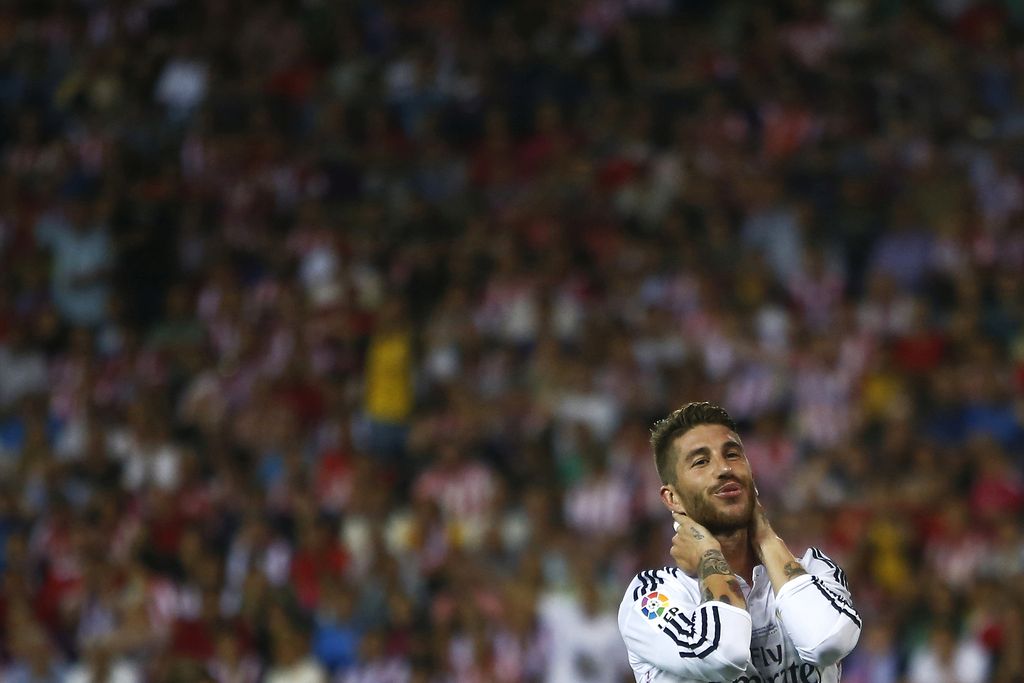 Real's Sergio Ramos gestures after missing a chance during a Spanish Supercup second leg soccer match between Real Madrid and Atletico Madrid at Vicente Calderon stadium in Madrid, Spain, early Saturday, Aug. 23, 2014. (AP Photo/Andres Kudacki)