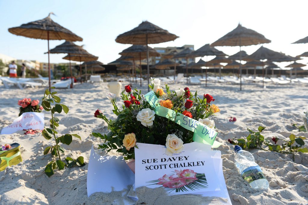 epa04822901 A floral tribute is placed at the site where Britons Sue Davey and Scott Chalkley were shot at the beach near of the Hotel Imperial Marhaba in Sousse, Tunisia, 28 June 2015. According to local reports 26 June, an assailant opened fire on tourists at two hotels, killing at least 37 people, including Germans, Britons and Belgians, and wounding several others, some while they were sunbathing. The attacker was killed later in a gun fight with Tunisian security services, while people believed to be associated with him have since been arrested in the country. The group which calls itself the Islamic State (IS) have claimed responsibility.  EPA/ANDREAS GEBERT