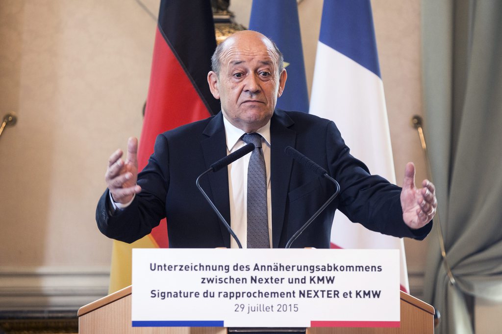 epa04865090 French Defense Minister Jean-Yves Le Drian delivers a speech prior to the signing ceremony of the merger between the French arm manufacturer Nexter and the German defense group KMW (Krauss-Maffei Wegmann) at the French Ministry of Defense in Paris, France, 29 July 2015.  EPA/ETIENNE LAURENT