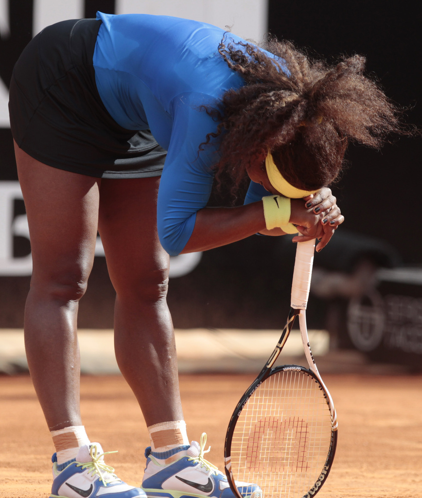 Serena Williams, of the United States, reacts after loosing a point against Russia's Nadia Petrova during their match at the Italian Open tennis tournament, in Rome, Wednesday, May 16, 2012. (AP Photo/Gregorio Borgia)