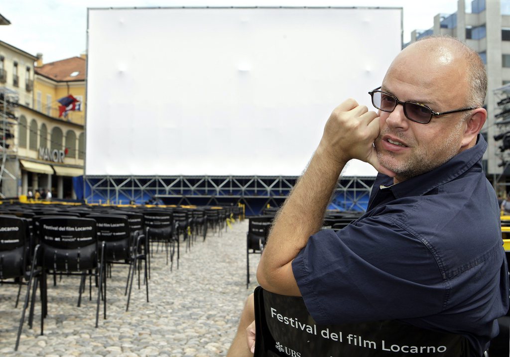 Swiss filmmaker Denis Rabaglia poses in front of the giant screen on Piazza Grande, where his movie "Marcello Marcello" will be presented Tuesday night, at the 61st International Film Festival Locarno, Monday, August 11, 2008, in Locarno, Switzerland.  (KEYSTONE/Martial Trezzini) *** EDITORIAL USE ONLY ***