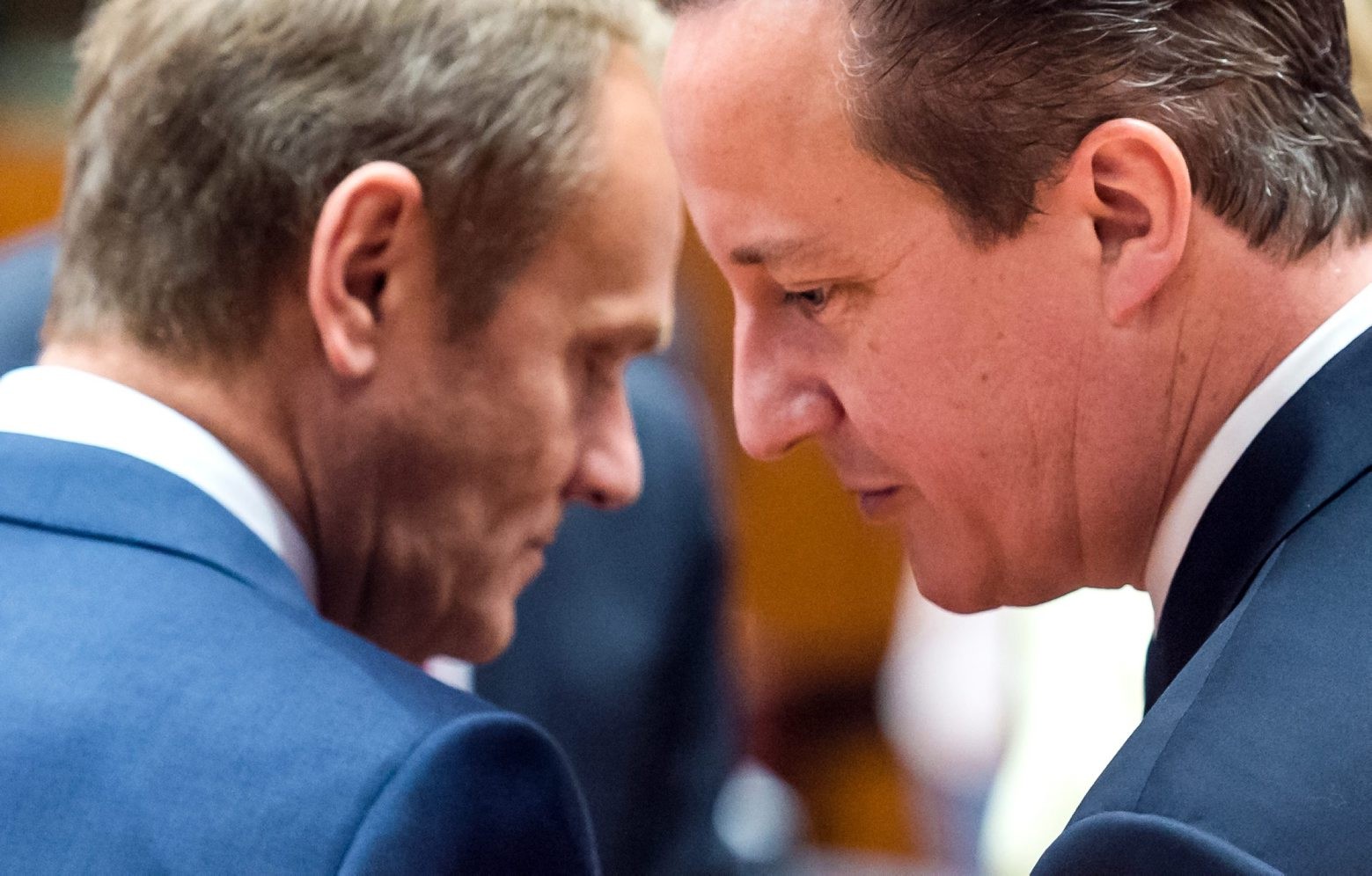 FILE - In this June 26, 2015 file photo, European Council President Donald Tusk, left, speaks with British Prime Minister David Cameron during a round table meeting at an EU summit in Brussels. European Council President Donald Tusk on Tuesday February 2, 2016 unveiled proposals that he hopes will keep Britain in the 28-nation European Union. (AP Photo/Geert Vanden Wijngaert, File) EU Britain Europe
