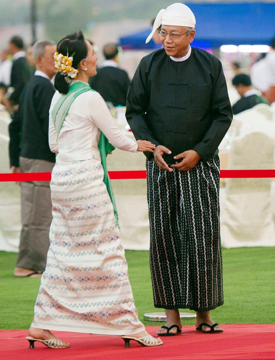 National League for Democracy leader Aung San Suu Kyi, left, is welcomed by new Myanmar President Htin Kyaw during a dinner reception in Naypyitaw, Myanmar, Wednesday, March 30, 2016. Htin Kyaw, a trusted friend of Nobel laureate Suu Kyi, took over as Myanmar's president Wednesday, taking a momentous step in the country's long-drawn transition toward democracy after more than a half-century of direct and indirect military rule. (Ye Aung Thu/Pool Photo via AP) Myanmar President