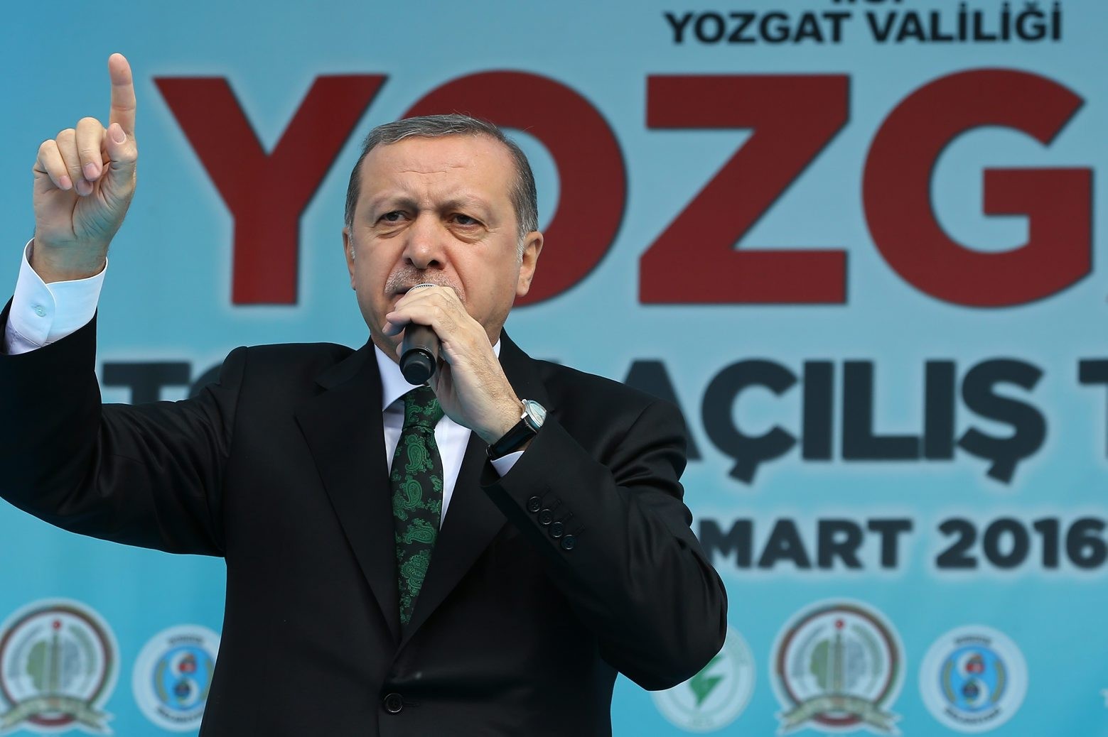 Turkish President Recep Tayyip Erdogan addresses a meeting in Sorgun, Yozgat, Turkey, Friday, March 25, 2016. Erdogan has criticized the Belgian authorities as "incapable" for not taking any action against one of the Brussels attackers after he was detained at the border with Syria and deported from Turkey. (AP Photo) Turkey Belgium Attacks