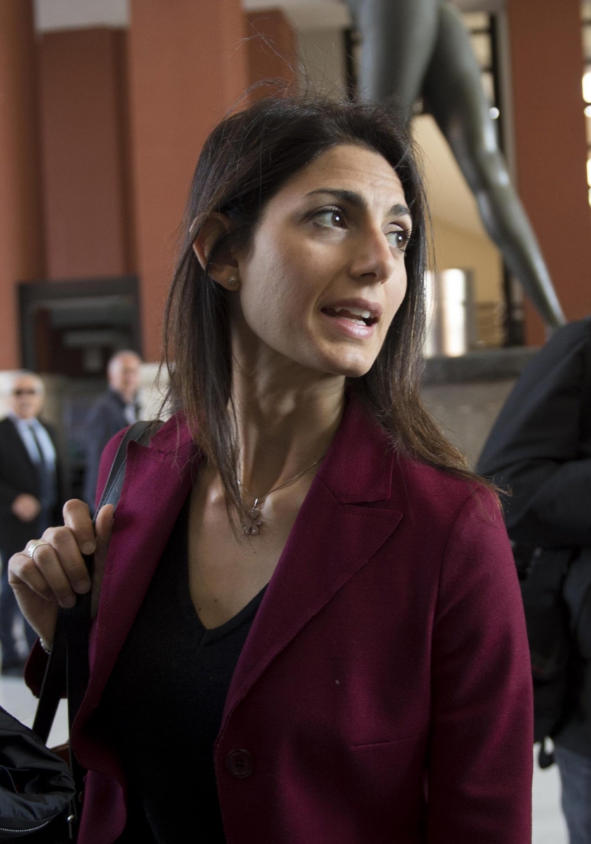 The candidate of the 5-Star Movement for Mayor of Rome, Virginia Raggi, arrives at the Italian National Olympic Committee headquarters for a private meeting with the President Giovanni Malago', in Rome, May 9, 2016. Raggi said she is maintaining her opposition to Rome's bid for the 2024 Olympics. (Maurizio Brambatti/ANSA via AP Photo) ITALY OUT ITALY ROME 2024 BID MAYOR