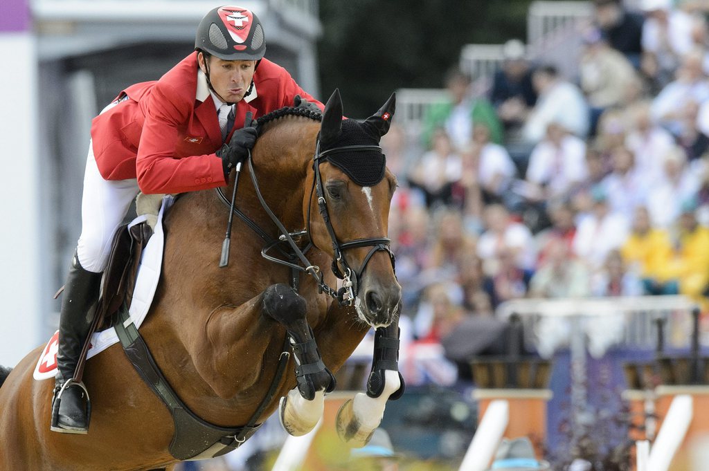 Switzerland's Steve Guerdat and his horse Nino des Buissonnets competes during the Individual Jumping finals in the Greenwich Park in London, Britain, at the London 2012 Olympic Summer Games, pictured on Wednesday, August 8, 2012. (KEYSTONE/Laurent Gillieron)