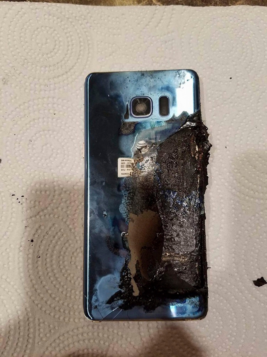 This Sept. 8, 2016, photo, shows a damaged Samsung Galaxy Note 7, in Marion, Ill., belonging to Joni Gantz Barwick, who was woken up at 3 a.m. by smoke and sparks from her Galaxy Note 7. Her nightstand and bed sheets were burnt. Consumers from Shanghai to New York are left wondering about Samsung's smartphone brand after the South Korean tech giant recalled the devices, and then recalled their replacements, too. (Joni Gantz Barwick via AP) Samsung-After Note 7