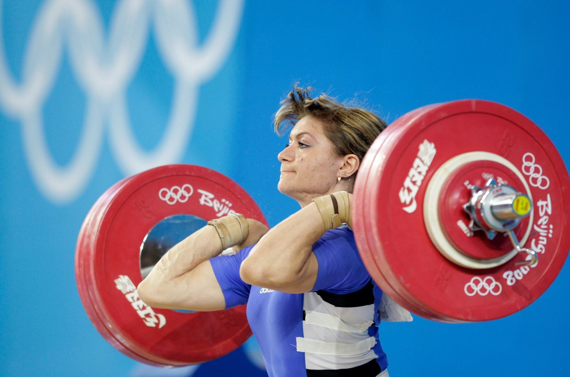 FILE In this Tuesday, Aug. 12, 2008 file photo silver medalist Irina Nekrassova from Kazakhstan makes a clean and jerk in the women's 63kg weightlifting competition at the 2008 Olympics in Beijing. Kazakhstan says three medalists are among six of its athletes disqualified from previous Olympics over doping. The country's national Olympic committee said in a statement that weightlifters Irina Nekrasova and Maria Grabovetskaya, who won silver and bronze medals respectively at Beijing 2008, and bronze medal-winning wrestler Aset Mambetov, were retroactively disqualified following retests of drug-test samples they gave at those games. (AP Photo/David Guttenfelder, File) KAZAKHSTAN DOPING RETESTS