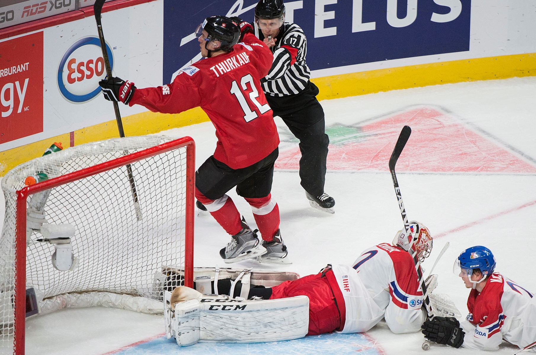 Czech Republic's goaltender Jakub Skarek and teammate David Kase, right, react after being scored on by Switzerland's Calvin Thurkauf (12) during second period preliminary round IIHF World Junior Championship hockey action in Montreal, Tuesday, Dec. 27, 2016. (Graham Hughes/The Canadian Press via AP) HKO World Juniors Switzerland Czech Republic