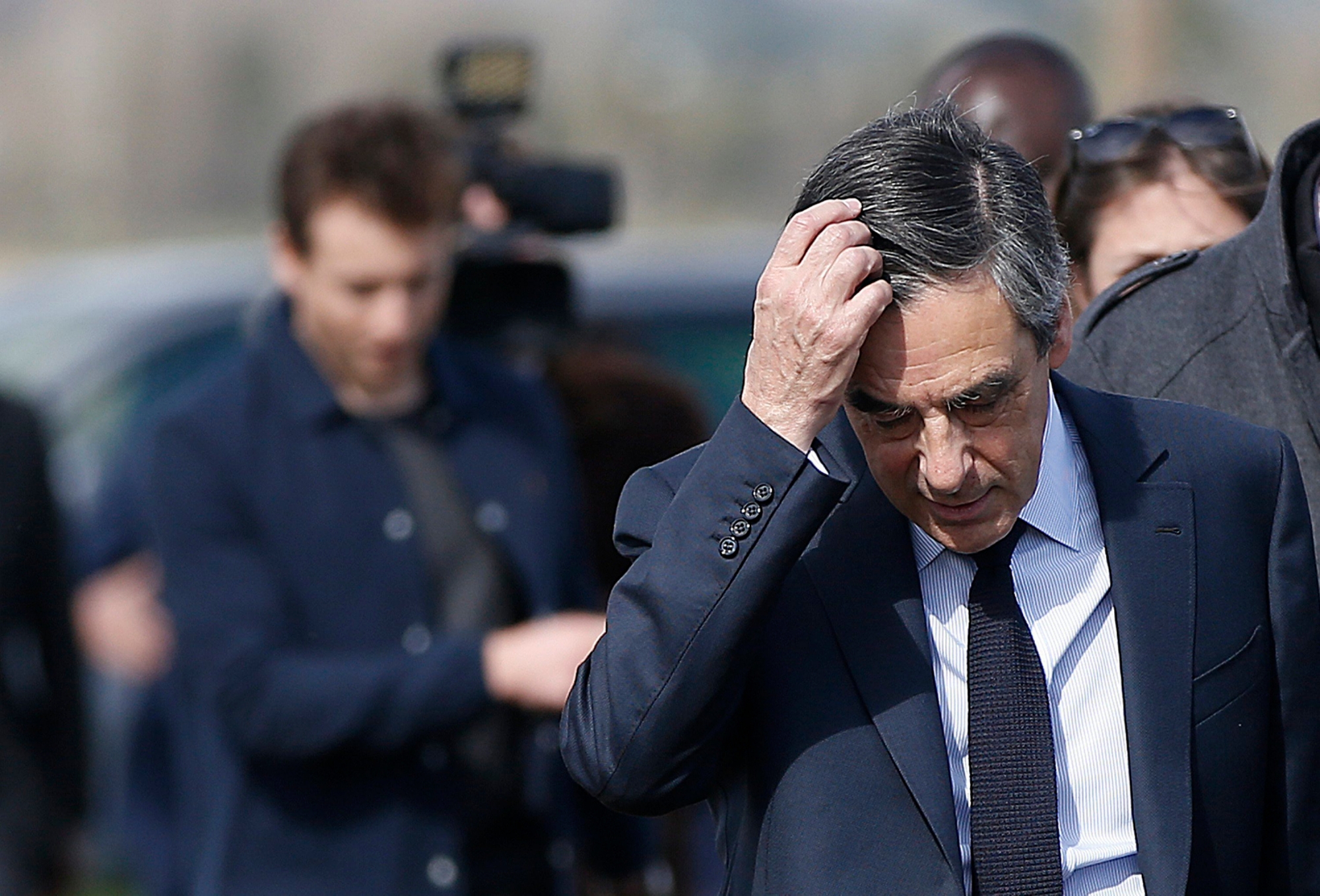 epa05847763 (FILE) A file picture dated 02 March 2017 shows Les Republicans party candidate for the 2017 presidential election Francois Fillon visiting a vineyard with  wineproducers in Nimes, southern France. Fillon's lawyer announced on 14 March 2017 that Francois Fillon was officially charged for several offences including misuse of public funds over the 'fake jobs' scandal.  EPA/GUILLAUME HORCAJUELO (FILE) FRANCE ELECTIONS FILLON