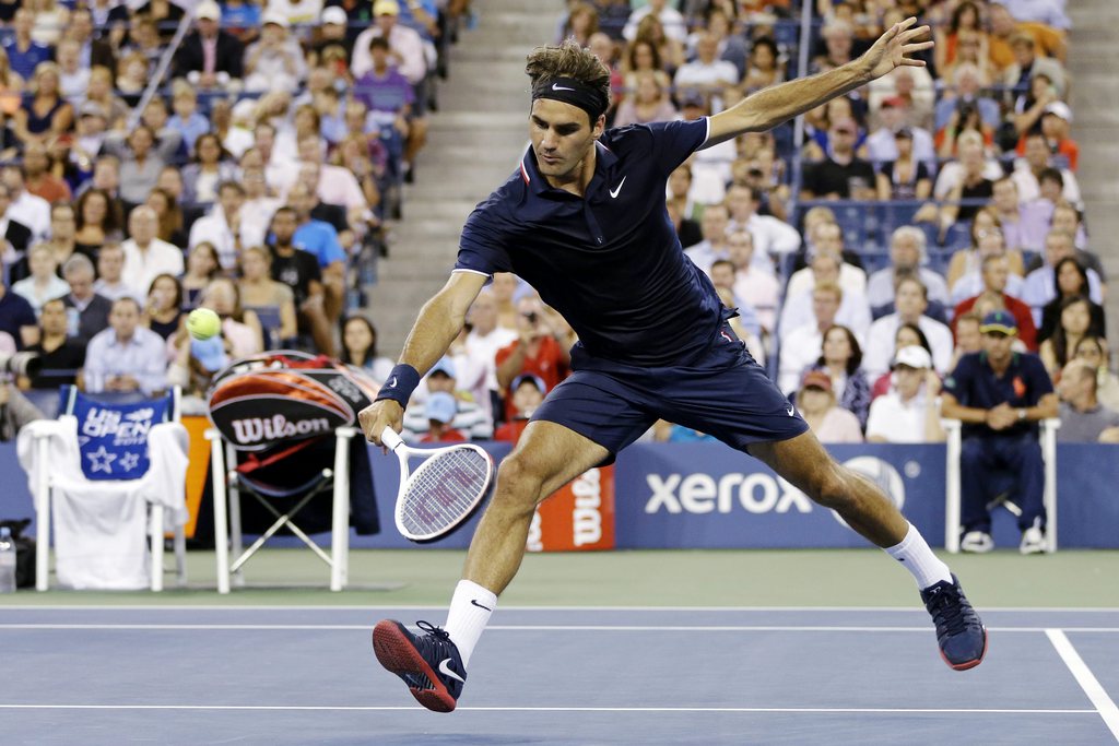 Roger Federer, of Switzerland, returns a shot Bjorn Phau, of Germany, during a match at the U.S. Open tennis tournament, Thursday, Aug. 30, 2012, in New York. (AP Photo/Darron Cummings)