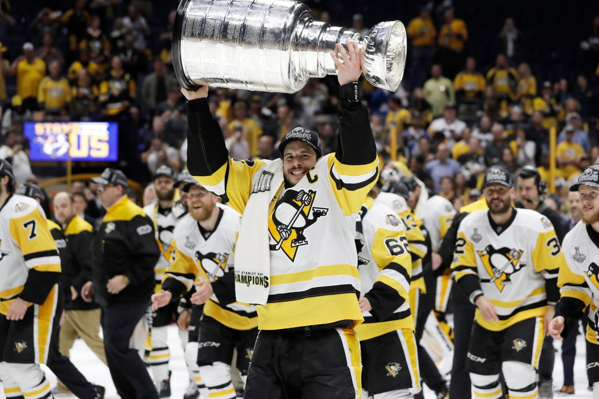 Pittsburgh Penguins' Sidney Crosby (87) celebrates with the Stanley Cup after defeating the Nashville Predators in Game 6 of the NHL hockey Stanley Cup Final, Sunday, June 11, 2017, in Nashville, Tenn. (AP Photo/Mark Humphrey) Stanley Cup Penguins Predators Hockey
