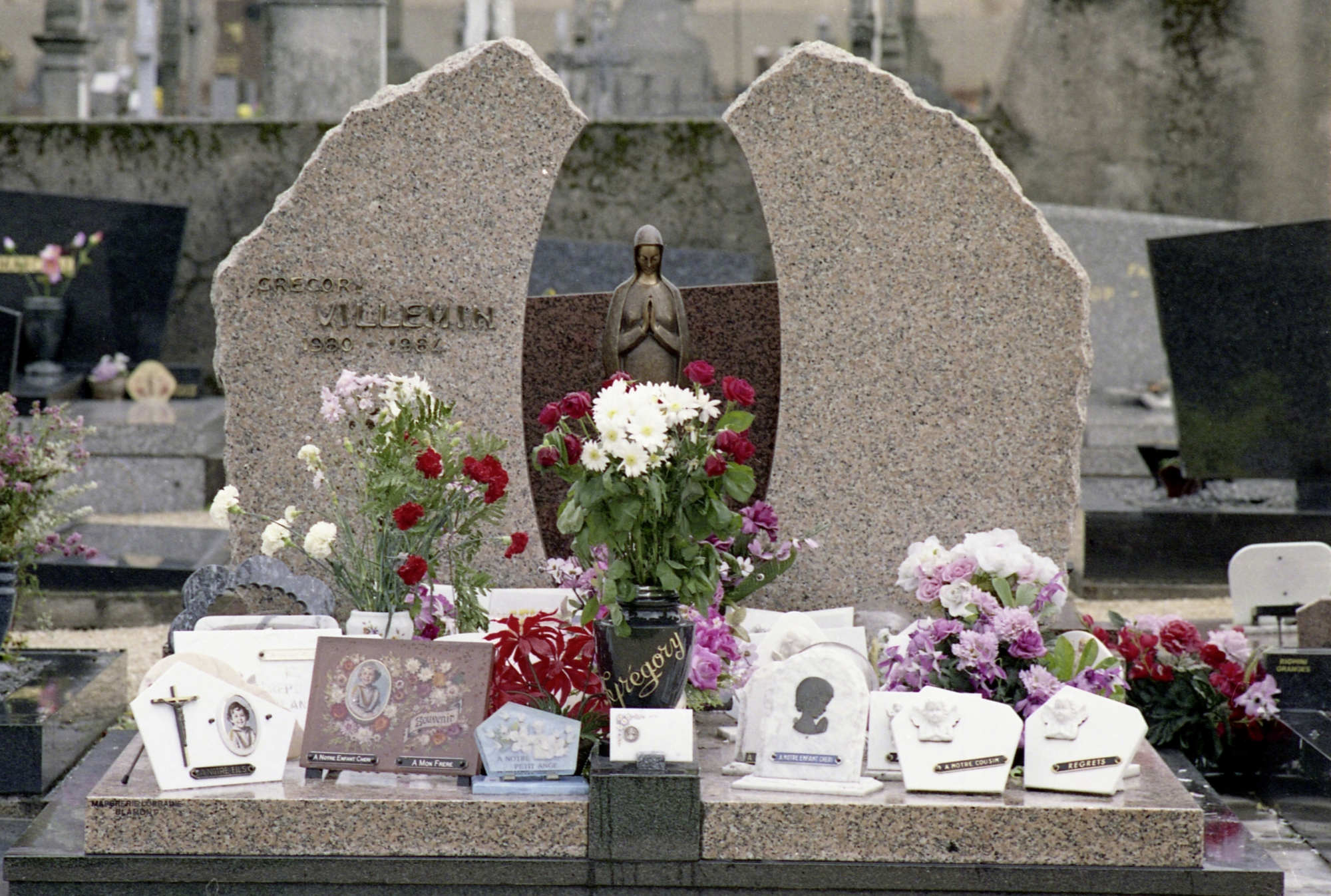 The grave of Grégory Villemin is seen in a village cemetery in Lepanges-sur-Vologne, south-west France in 1987. Grégory Villemin was found dead in the Vologne River in Eastern France on Oct. 16, 1984. (AP Photo/Michel Lipichitz) France Gregory Villemin