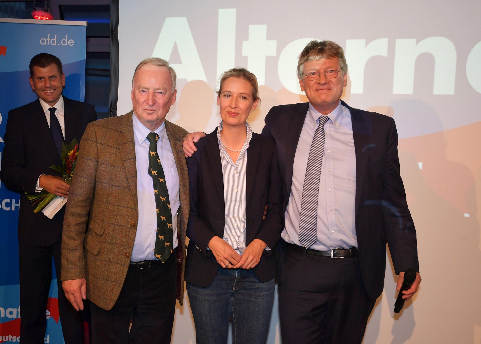 epa06224736 (L-R) Co-top candidates Alexander Gauland and Alice Weidel of the German right-wing populist party 'Alternative for Germany' (AfD) and AfD federal co-chairman Joerg Meuthen pose at a night club where right-wing populist party AfD holds their election event in Berlin, Germany, 24 September 2017. According to federal election commissioner more than 61 million people were eligible to vote in the elections for a new federal parliament, the Bundestag, in Germany.  EPA/CHRISTIAN BRUNA GERMANY ELECTIONS 2017