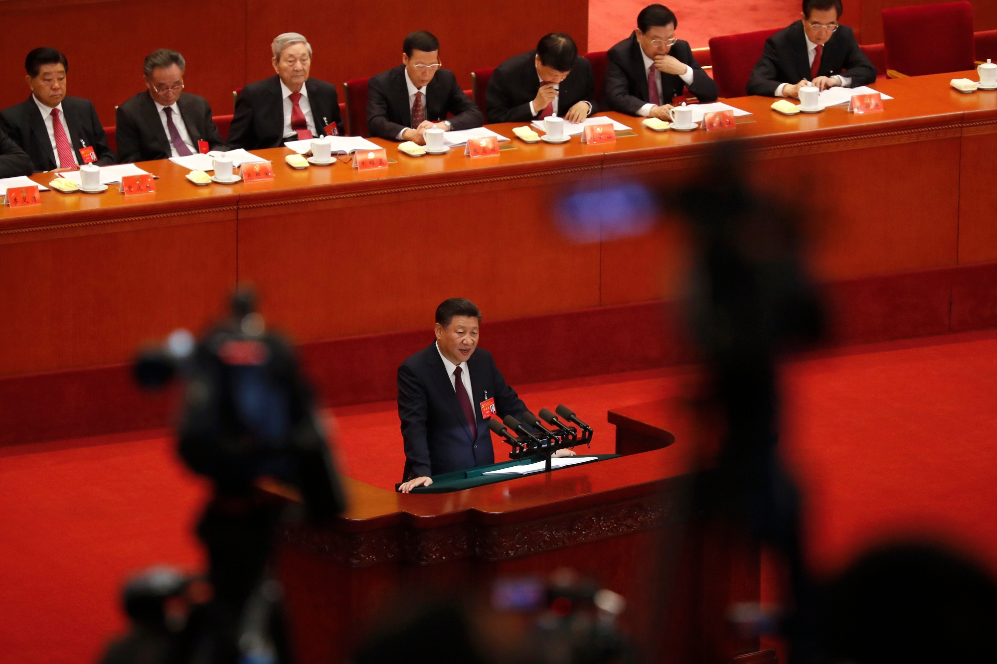 Chinese President Xi Jinping delivers a speech at the opening ceremony of the 19th Party Congress at the Great Hall of the People in Beijing, Wednesday, Oct. 18, 2017. Xi on Wednesday urged a reinvigorated Communist Party to take on a more forceful role in society and economic development to better address "grim" challenges facing the country as he opened a twice-a-decade national congress. (AP Photo/Andy Wong) APTOPIX China Party Congress