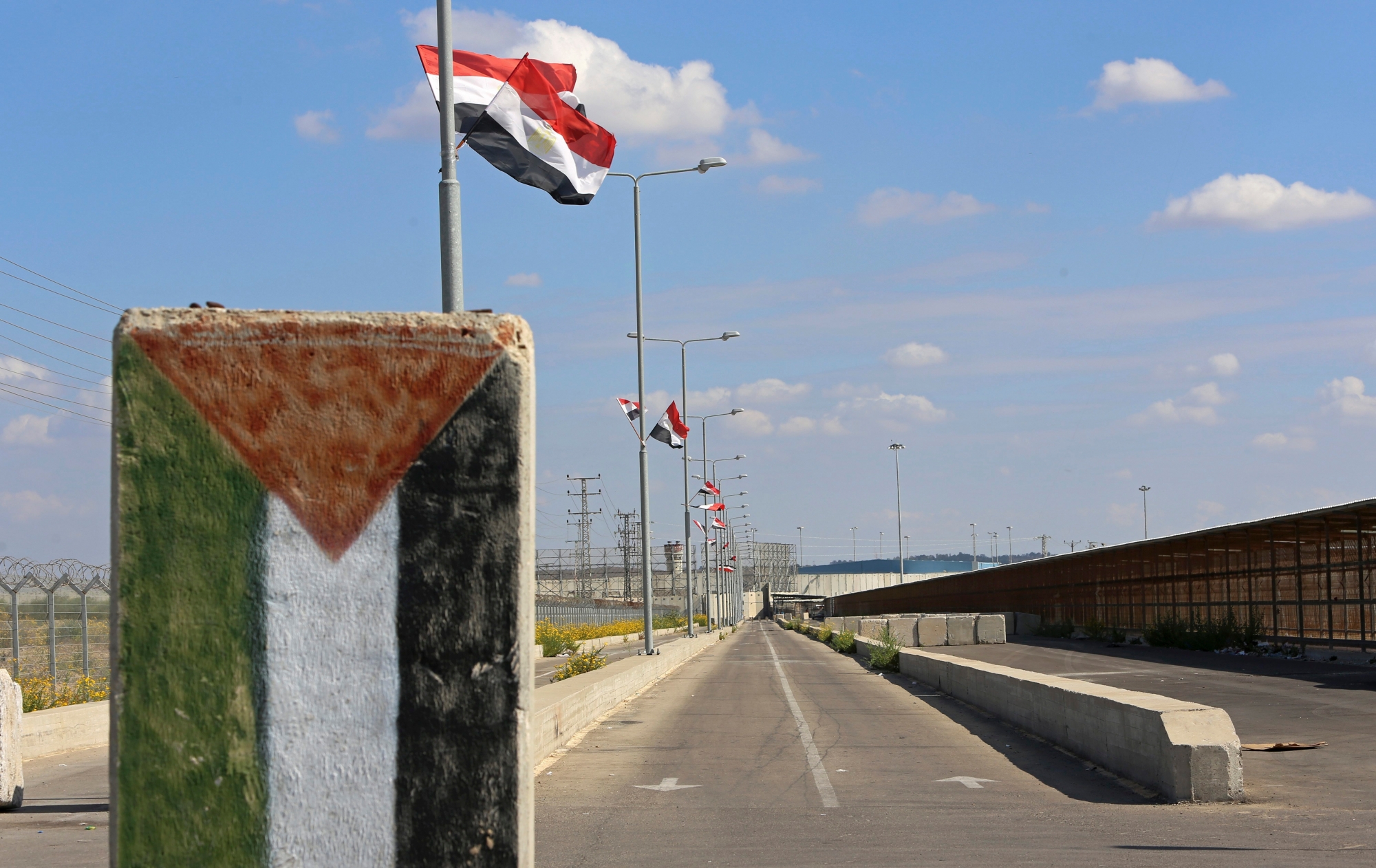 Egyptian flags fly at the passageway leading to Israeli at the Palestinian side of the Erez checkpoint between Israel and Gaza, at Beit Hanoun, Gaza Strip, Wednesday, Nov. 1, 2017. The Islamic militant Hamas group has handed over control of GazaÄôs border crossings with Israel and Egypt to the internationally recognized Palestinian Authority. WednesdayÄôs handover was the first tangible step in implementing a reconciliation deal between Hamas and the rival Fatah party, which controls the Palestinian Authority. (AP Photo/Adel Hana) Palestinians Reconciliation