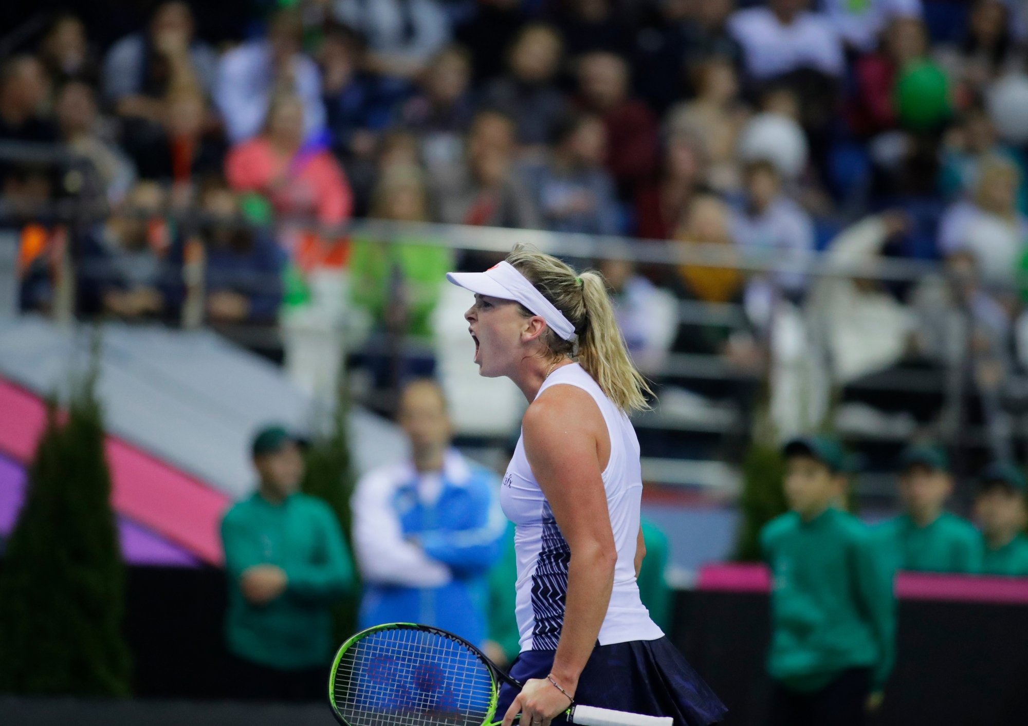 CoCo Vandeweghe of the United States celebrates after winning a point against Aliaksandra Sasnovich of Belarus during the Fed Cup final match between Belarus and USA, in Minsk, Belarus, Saturday, Nov. 11, 2017. (AP Photo/Sergei Grits) Belarus Tennis Fed Cup