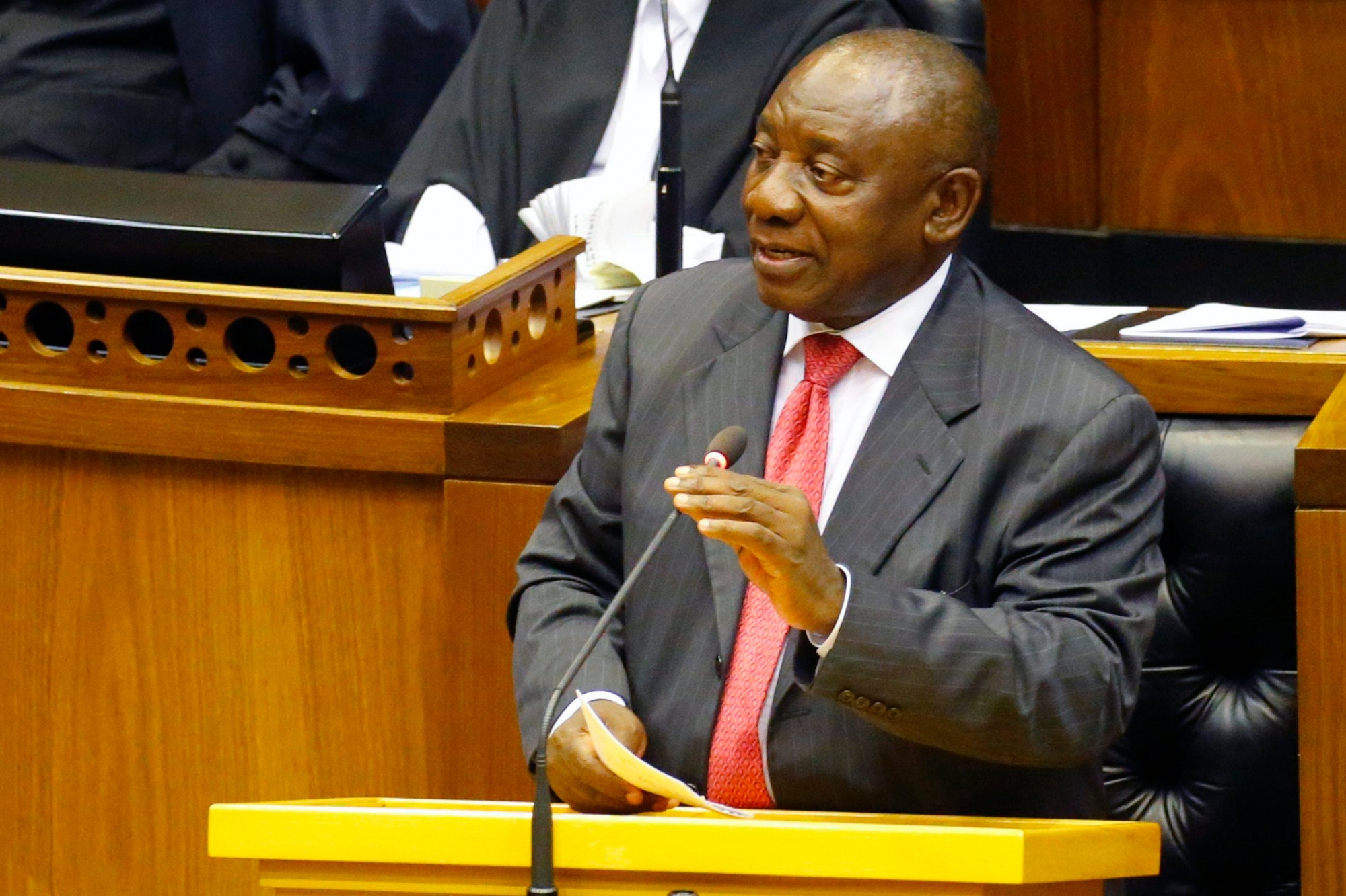 epa06528486 Newly elected President of South Africa Cyril Ramaphosa addresses Parliament during an extraordinary sitting after the resignation of President Jacob Zuma, Cape Town, South Africa, 15 February 2018. Acting President, Cyril Ramaphosa will be sworn in during the sitting. President Zuma's resignation overnight comes after he was under intense pressure to resign amidst ongoing corruption and state capture allegations.  EPA/MIKE HUTCHINGS / POOL SOUTH AFRICA ACTING PRESIDENT CYRIL RAMAPHOSA