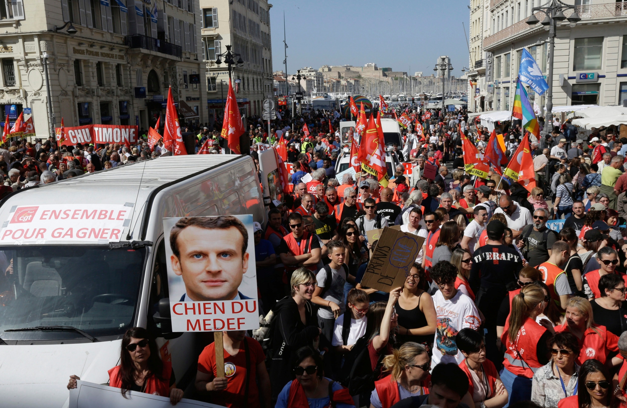 Rail workers and civil servants demonstrate in the Old Port in Marseille, southern France, Thursday, April, 19, Rail workers and civil servants demonstrate in Marseille, southern France, Thursday, April, 19, 2018. Thousands of people are expected to march in protest at French President Emmanuel Macron's reforms as rail strikes and student protests continue to shake the country. Rail workers have this week resumed their rolling strike aimed at fighting Macron's plans to revamp the national railway company SNCF before the network is opened to competition, while students continue to occupy campuses across France. (AP Photo/Claude Paris) France Strikes