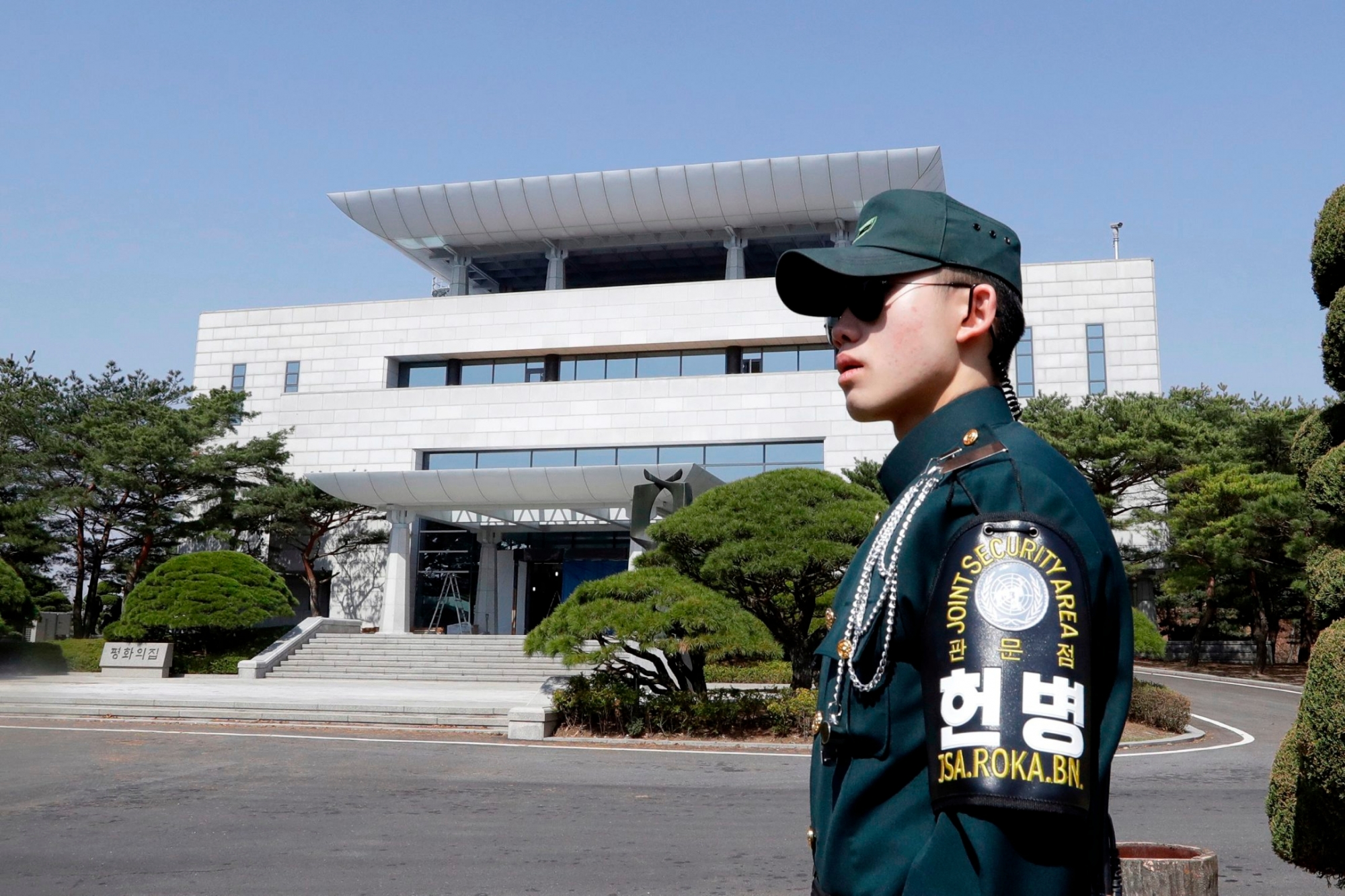 FILE - In this April 18, 2018, file photo, a South Korean soldier stands outside of the Peace House, the venue for the planned summit between South Korean President Moon Jae-in and North Korean leader Kim Jong Un on April 27, during a press tour at the southern side of the Panmunjom in the Demilitarized Zone, South Korea. Kim Jong Un will be in unchartered territory when the third-generation autocrat crosses over to the southern half of the Demilitarized Zone separating the rival Koreas on Friday, possibly on foot, and greets South Korean President Moon Jae-in. (AP Photo/Lee Jin-man, File) Koreas Summit The Optics