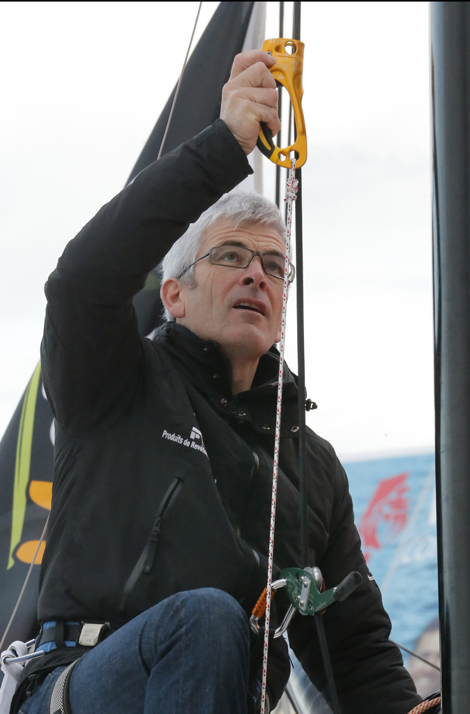 French  skipper Vincent Riou works on his yacht's mast in port Les Sables d'Olonne Western France  Thursday, Nov. 8, 2012.  The Vendee Globe sailing race, an around-the-world solo race that's held every four years, will start next  Saturday. (AP Photo/ Jacques Brinon)